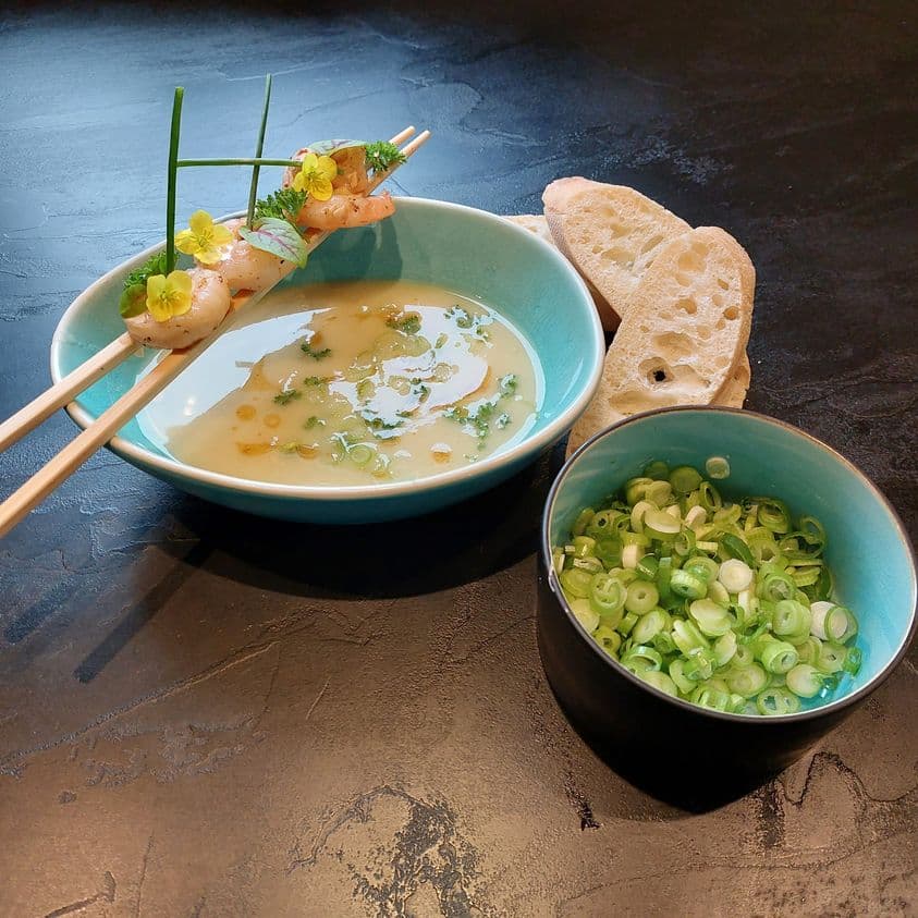 Potato garlic soup with prawns