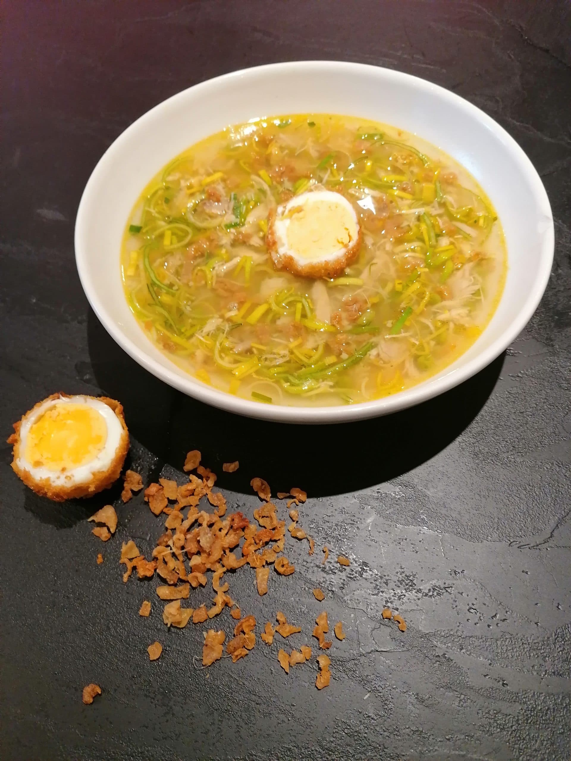 Spicy chicken soup with a breaded egg
